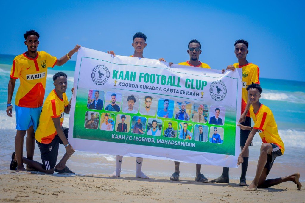 Kaah FC players celebrating with club banner